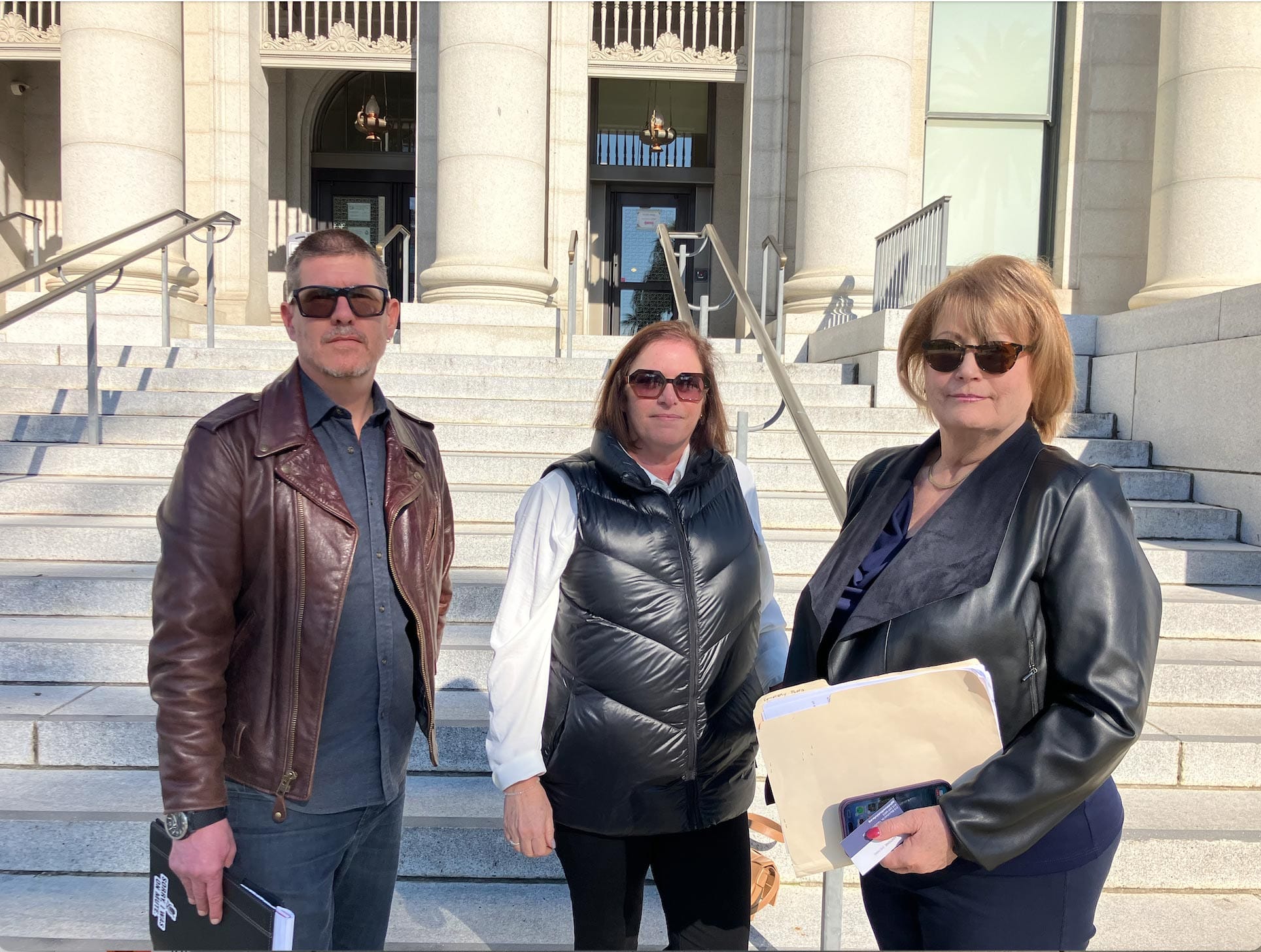 Jewish congregate executive directors Gordon Gladstone, left, and Tracey Klapow, center, stand outside of Solano Superior Court along with Jan Richard Carragher, left, on Jan 30. 