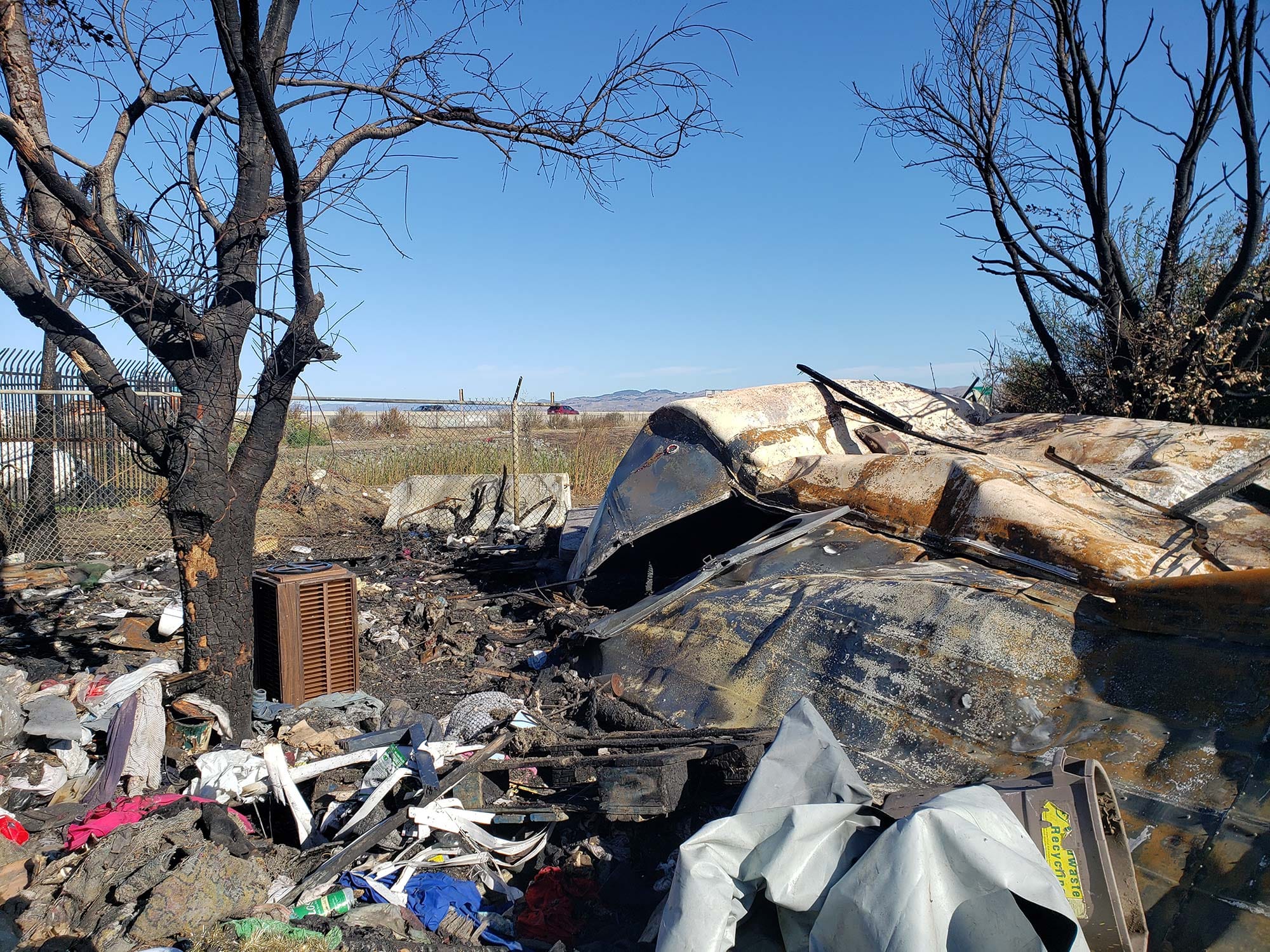 A burned trailer at a homeless encampment off Sacramento Street. 