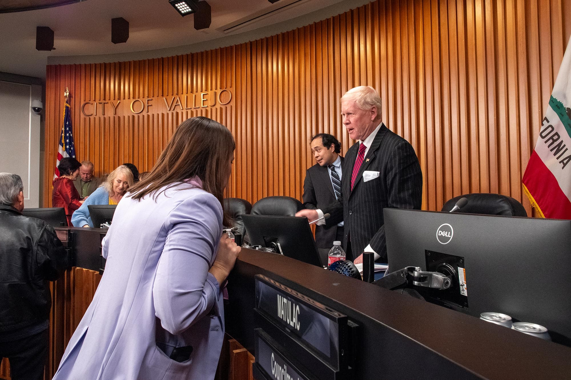 Newly elected Vallejo Mayor Andrea Sorce, left, talks to outgoing Mayor Robert McConnell, right.