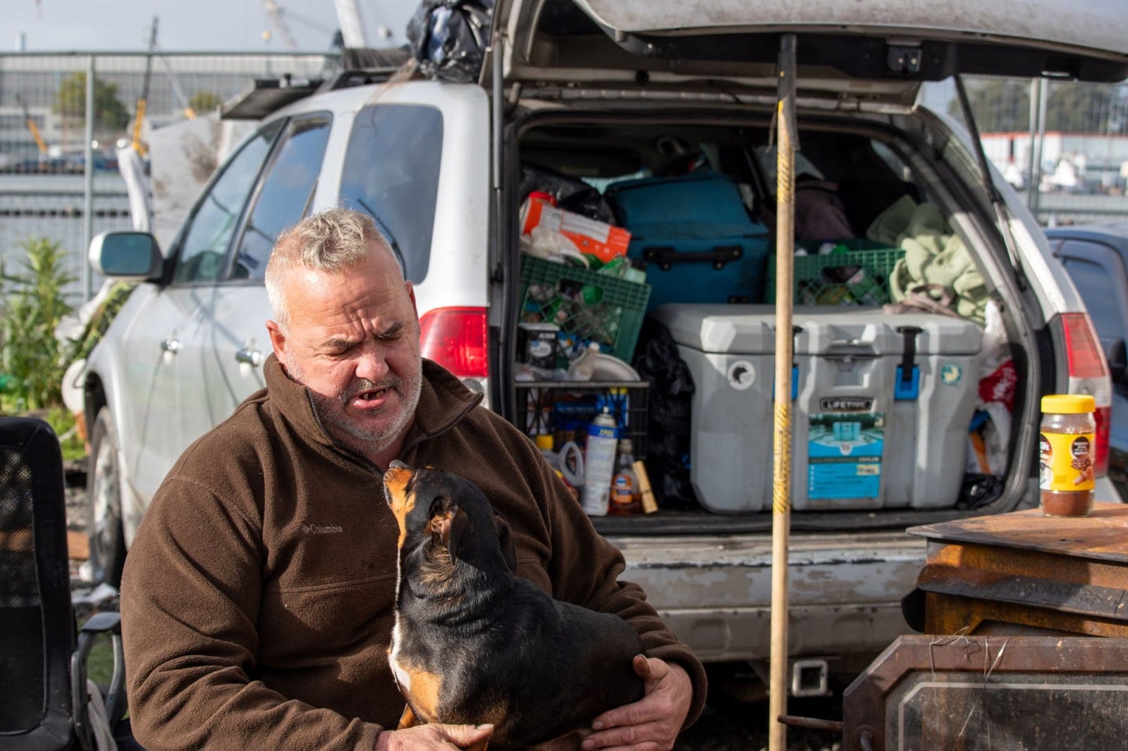 A man and his dog getting packed up and ready to leave Vallejo's boat launch area during an eviction in February.